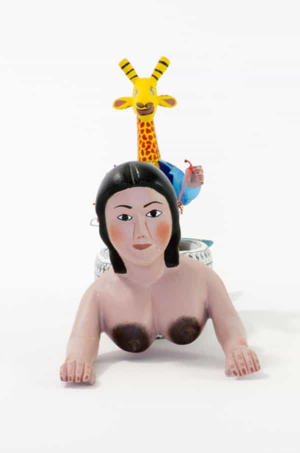 mermaid and giraffe mexican wood carving alebrije A very imaginative Mexican wood carving by Agustin Cruz. This piece has a giraffe with human body sailing a boat with the shape of a mermaid. Extraordinary Mexican art from MexArt, London UK.