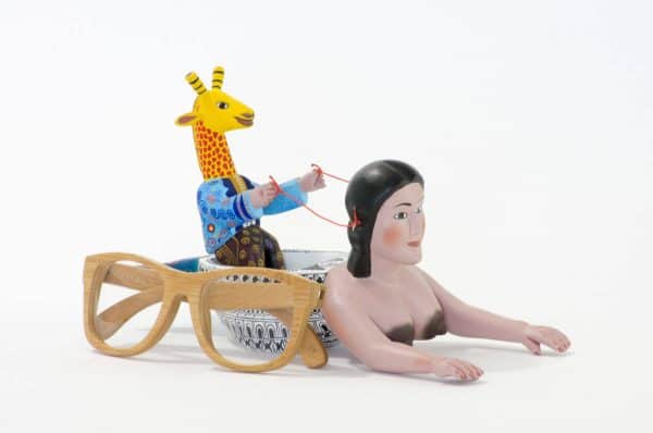 mermaid and giraffe mexican wood carving alebrije A very imaginative Mexican wood carving by Agustin Cruz. This piece has a giraffe with human body sailing a boat with the shape of a mermaid. Extraordinary Mexican art from MexArt, London UK.