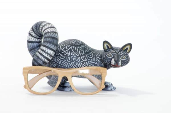 small black and white racoon mexican wood carving alebrije A black and white racoon with captivating eyes by young artist Giovanni Melchor. Extraordinary Mexican art from MexArt, London UK.