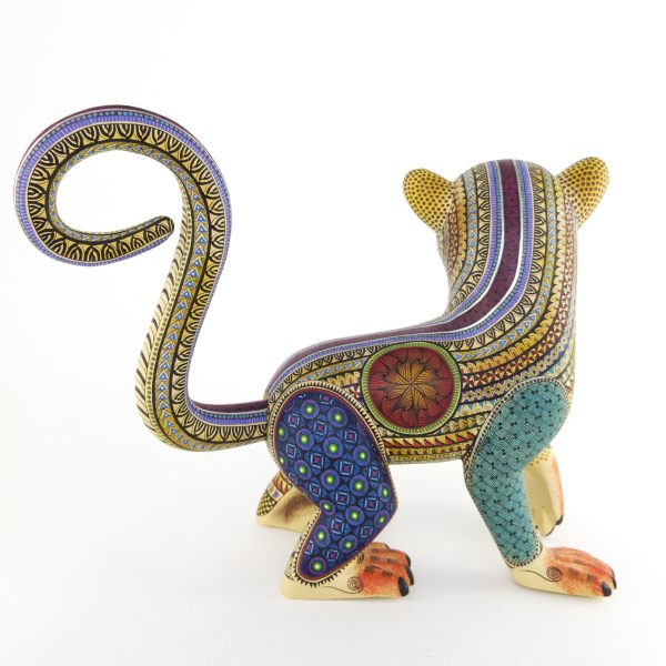 alebrije-large-monkey-brown-yellow-blue Beautiful smiley monkey alebrije painted in delicate patterns. Yellow body, brown face, blue legs and a detachable tail.