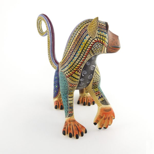 alebrije-large-monkey-brown-yellow-blue Beautiful smiley monkey alebrije painted in delicate patterns. Yellow body, brown face, blue legs and a detachable tail.