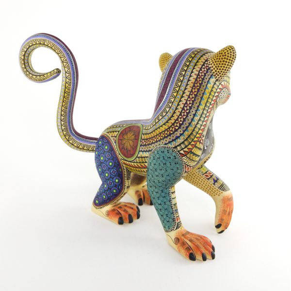 alebrije-large-monkey-brown-yellow-blue Beautiful smiley monkey alebrije painted in delicate patterns. Yellow body, brown face, blue legs and a detachable tail.