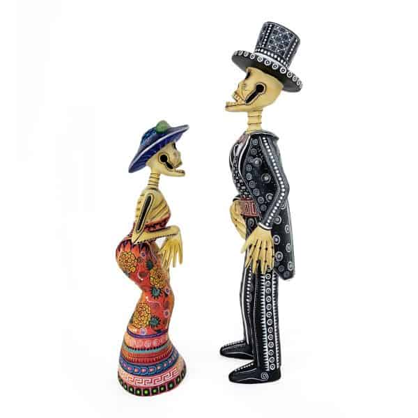 alebrijes-catrin-catrina-skelleton-couple handmade, hand carved pair of elegant skulls representing a catrin and a catrina with hats